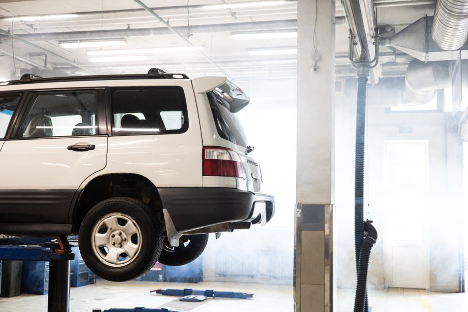 Car lifted in a professional auto garage